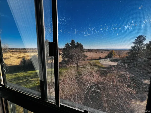 a view of swimming pool from a balcony