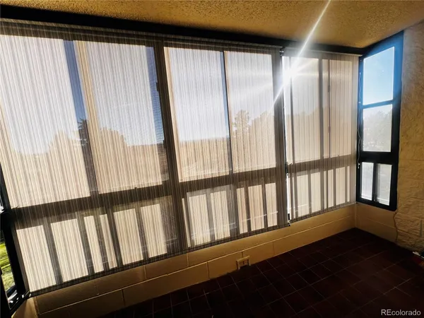 a view of wooden floor and windows