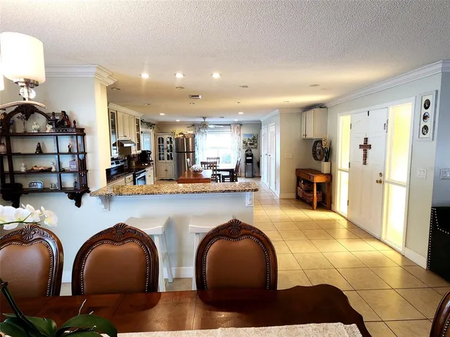a kitchen with stainless steel appliances granite countertop a stove and a refrigerator