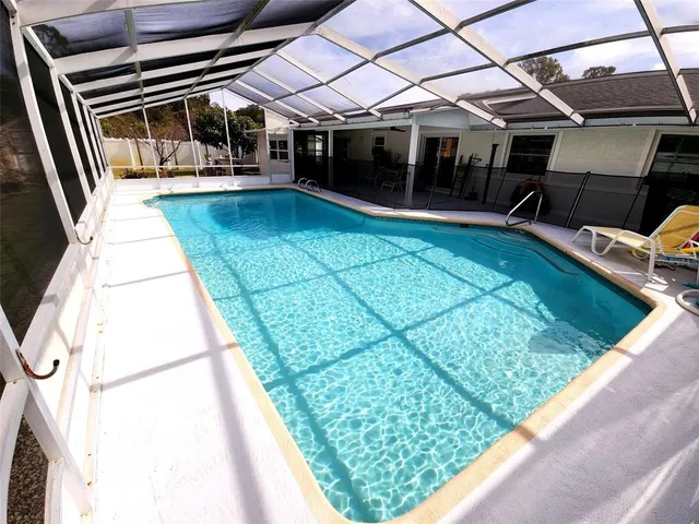 a view of a backyard with sitting area