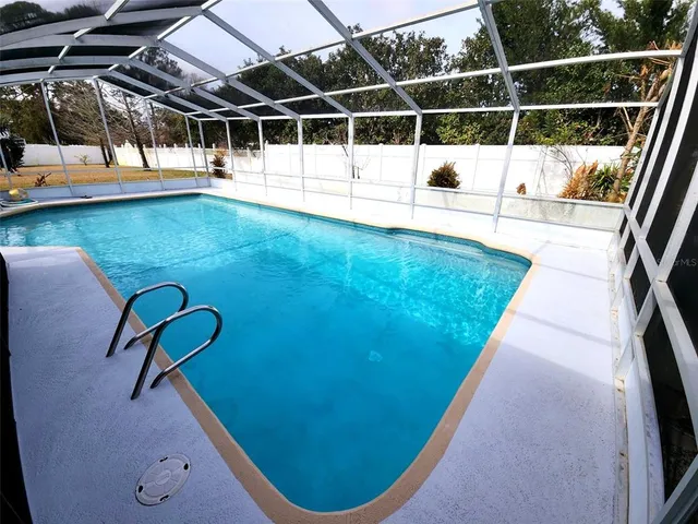 a view of a swimming pool with a swimming pool