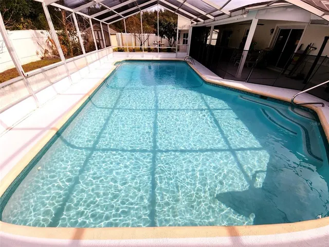 a view of balcony with a swimming pool