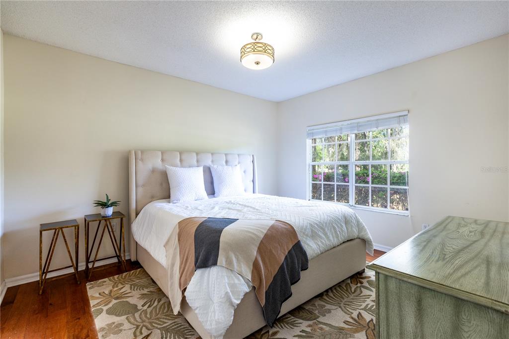 10000 Southwest 52nd Avenue, Unit 124 Gainesville, FL 32608 - Photo 12 of 33 a bedroom with a bed and a window