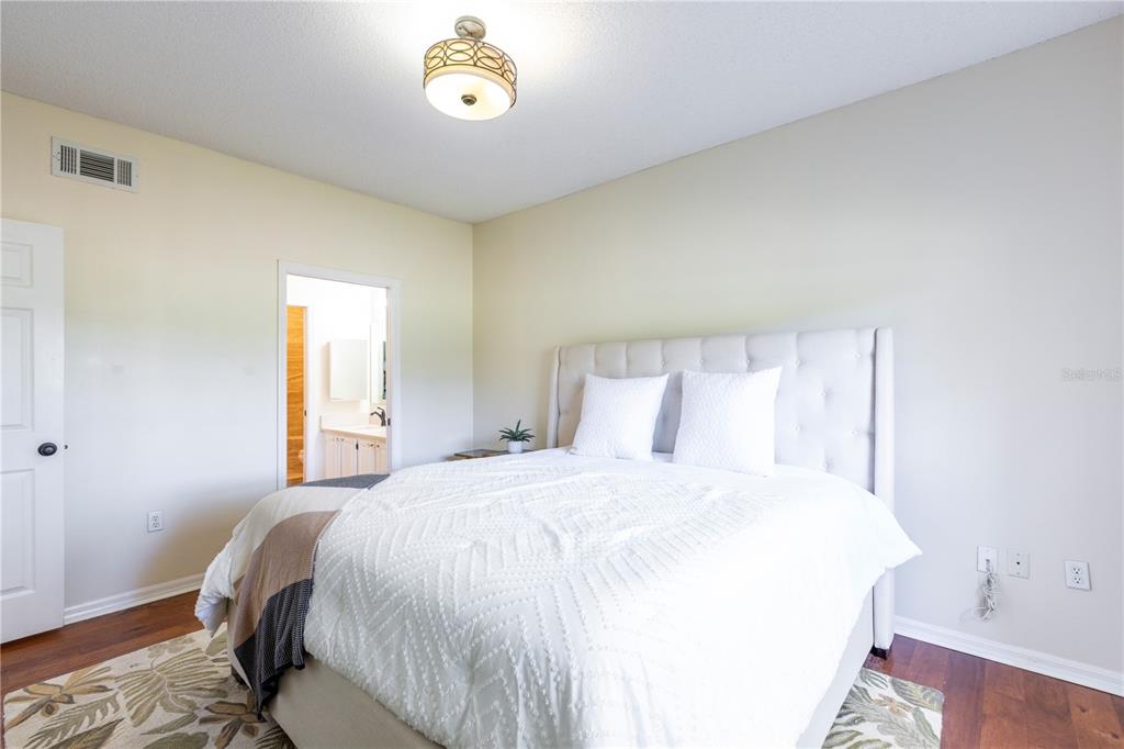10000 Southwest 52nd Avenue, Unit 124 Gainesville, FL 32608 - Photo 13 of 33 a bedroom with a bed and a table