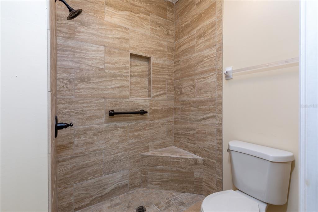 10000 Southwest 52nd Avenue, Unit 124 Gainesville, FL 32608 - Photo 15 of 33 a bathroom with a toilet and a shower