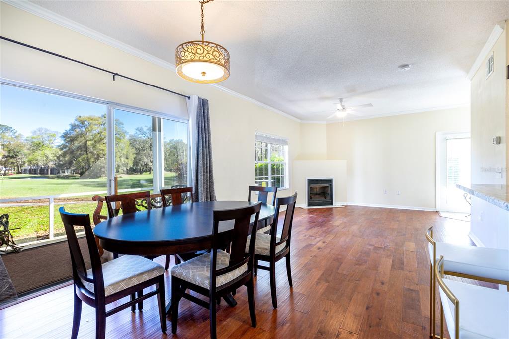 10000 Southwest 52nd Avenue, Unit 124 Gainesville, FL 32608 - Photo 24 of 33 a view of a dining room with furniture window and wooden floor