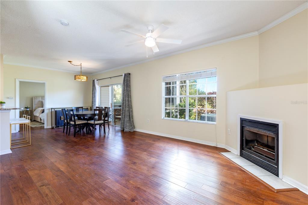 10000 Southwest 52nd Avenue, Unit 124 Gainesville, FL 32608 - Photo 25 of 33 a view of dining room with furniture and fireplace
