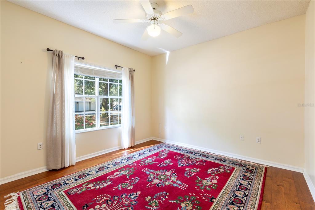 10000 Southwest 52nd Avenue, Unit 124 Gainesville, FL 32608 - Photo 28 of 33 a bedroom with a bed and a window