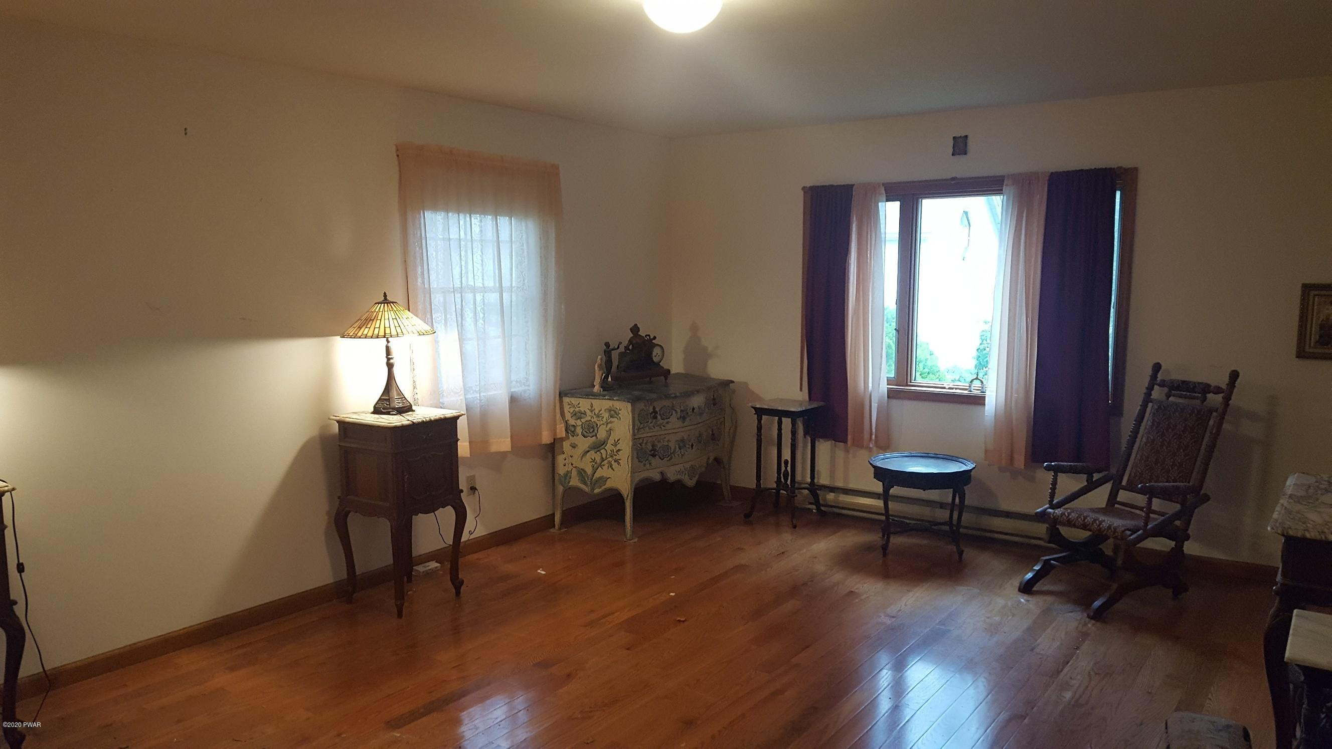 554 St Tikhons Road Waymart, PA 18472 - Photo 12 of 29 a living room with furniture and a window