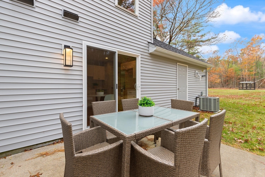 9 Barracks Road, Unit 9 Hudson, MA 01749 - Photo 14 of 16 a view of backyard of house with seating space