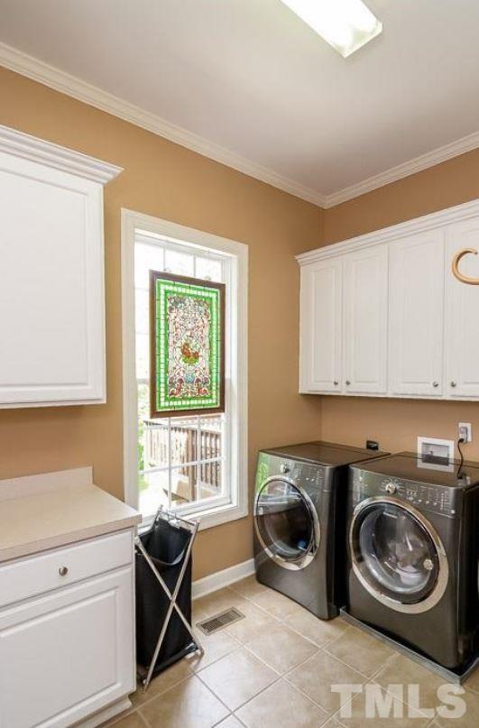 2913 Elmfield Street Raleigh, NC 27614 - Photo 12 of 30 Laundry Room with Sink, Ironing Center and Storage.