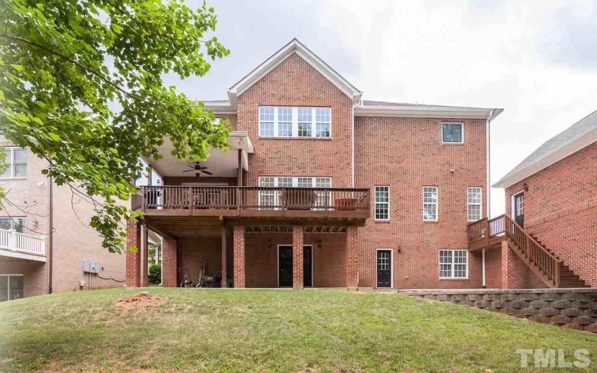 2913 Elmfield Street Raleigh, NC 27614 - Photo 3 of 30 Wooded Backyard showcasing Deck, Patio and Private Office