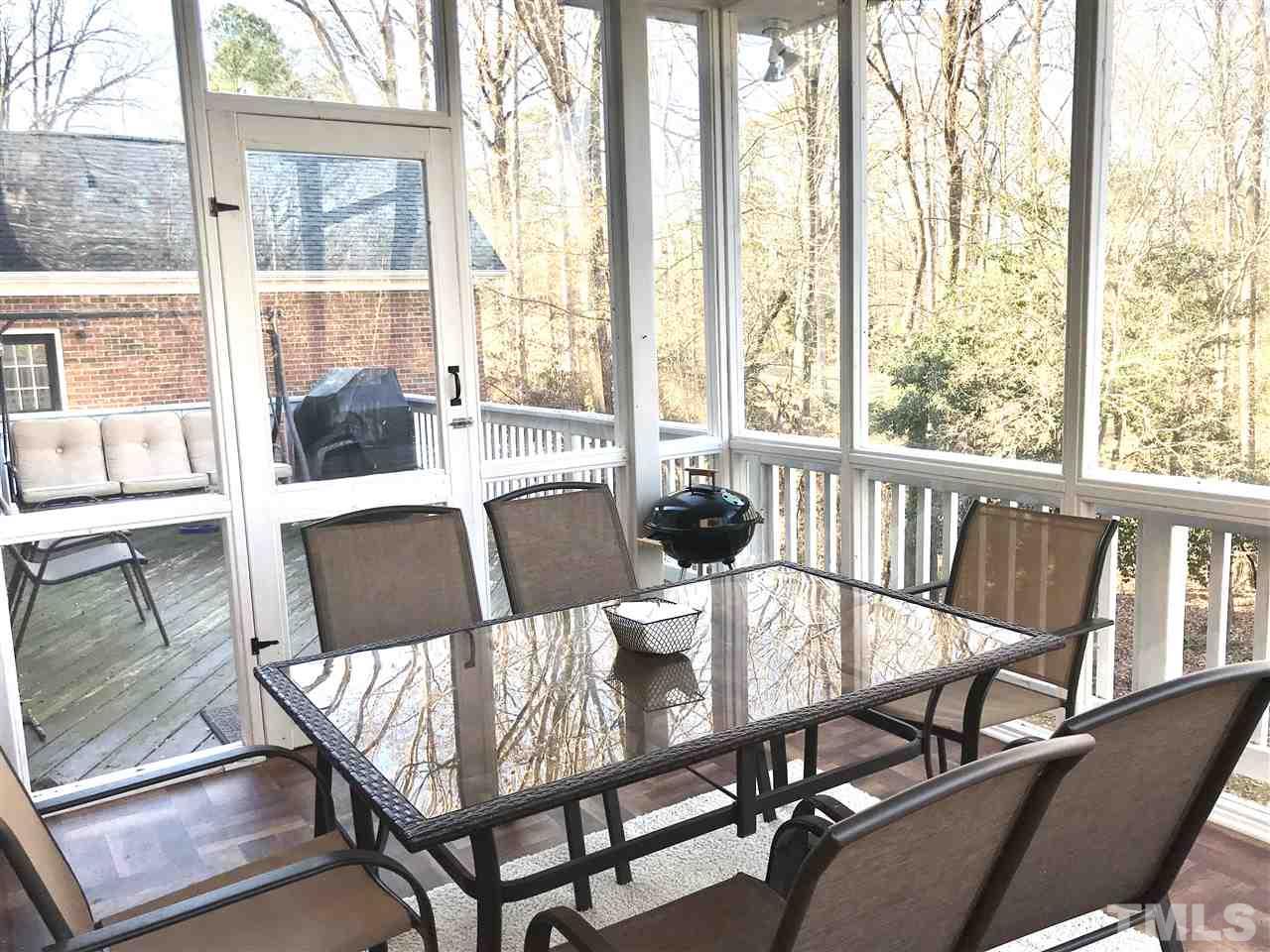 2913 Elmfield Street Raleigh, NC 27614 - Photo 30 of 30 Large deck with open area and enclosed space with amazing wooded views of TPC Wakefield
