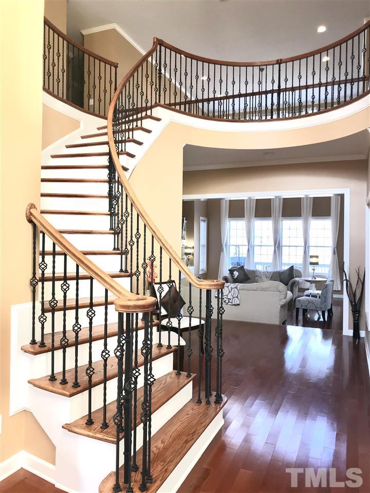 2913 Elmfield Street Raleigh, NC 27614 - Photo 4 of 30 Curved Stairway showcasing Two Story Foyer