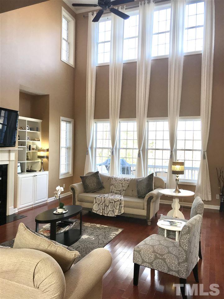 2913 Elmfield Street Raleigh, NC 27614 - Photo 5 of 30 Sunken Living Room with Two-Story Ceilings, Fireplace, and Built-Ins.