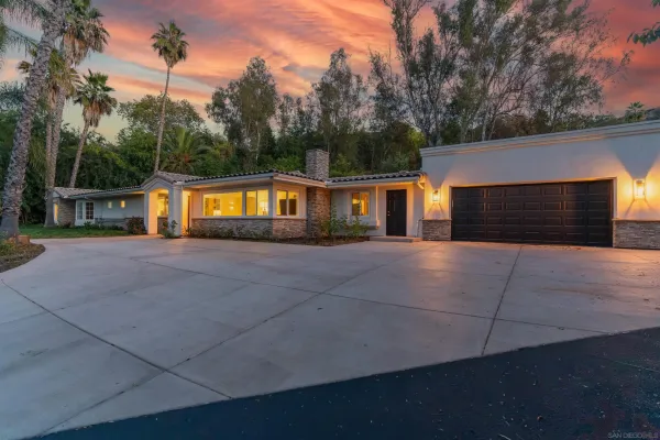 a view of house next to a yard