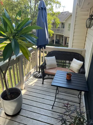 a view of outdoor space with lounge chairs