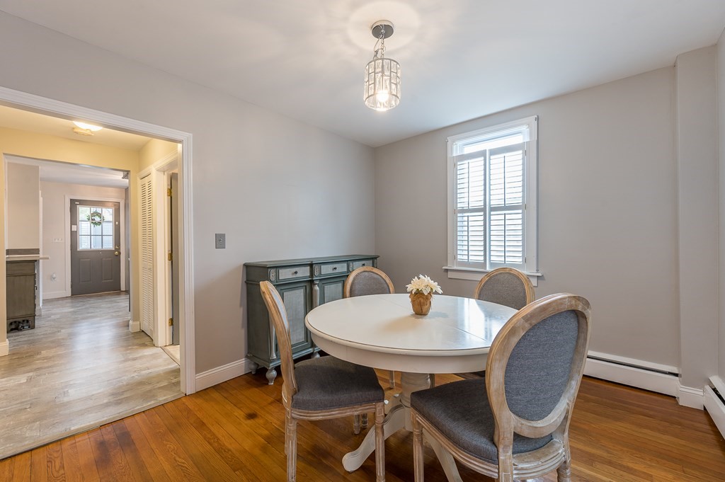 265 Main Street Sturbridge, MA 01566 - Photo 17 of 25 a view of a dining room with furniture and wooden floor