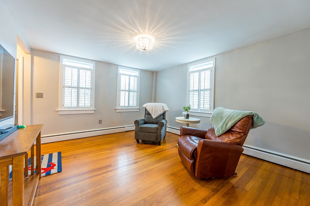 265 Main Street Sturbridge, MA 01566 - Photo 20 of 25 a living room with furniture and a large window