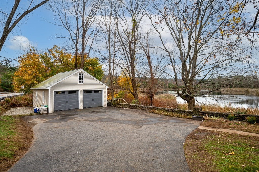 265 Main Street Sturbridge, MA 01566 - Photo 2 of 25 a view of a house with a yard covered in snow