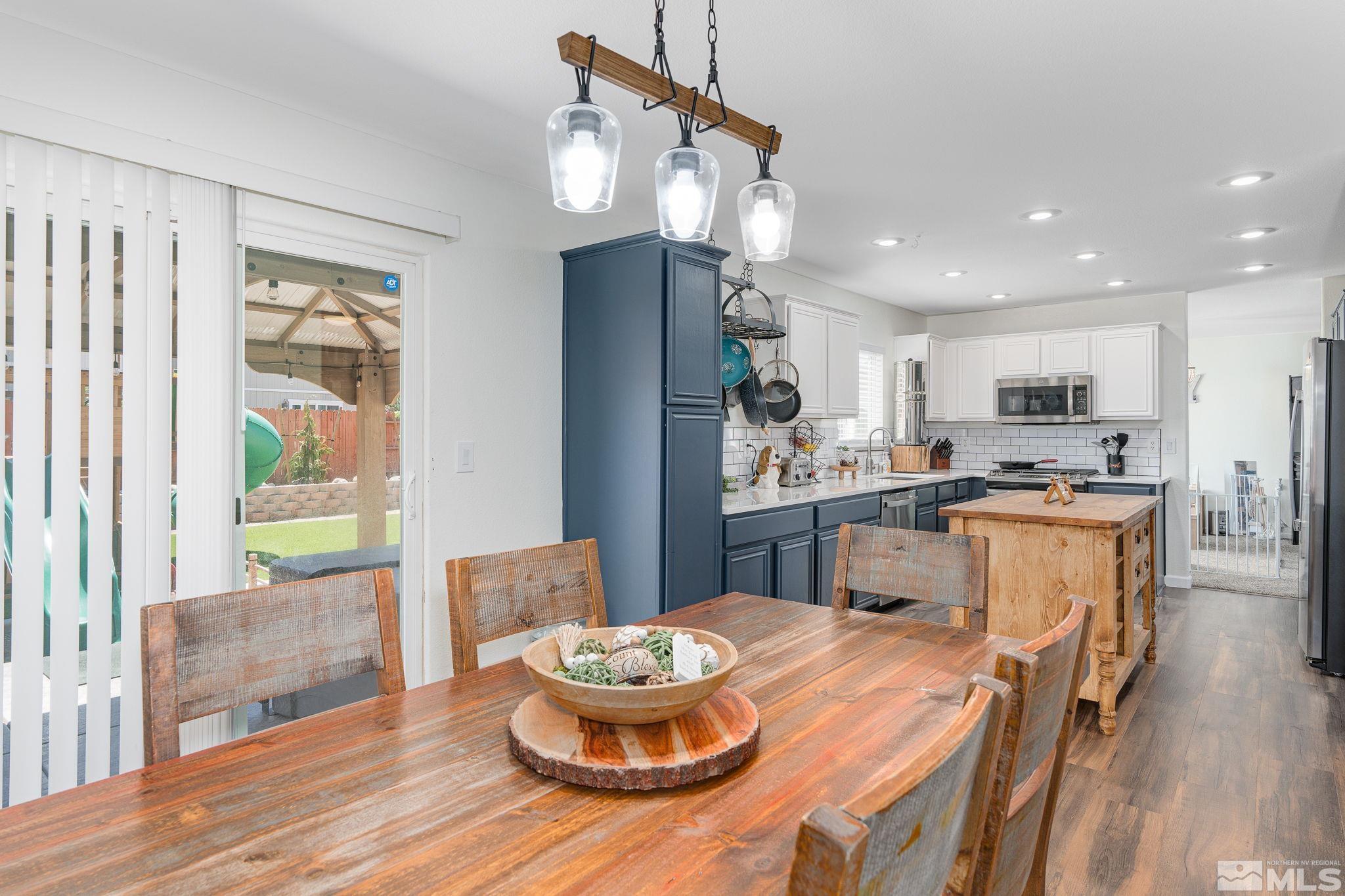 18198 Pin Oak Court Reno, NV 89508 - Photo 11 of 39 a kitchen with a table and chairs