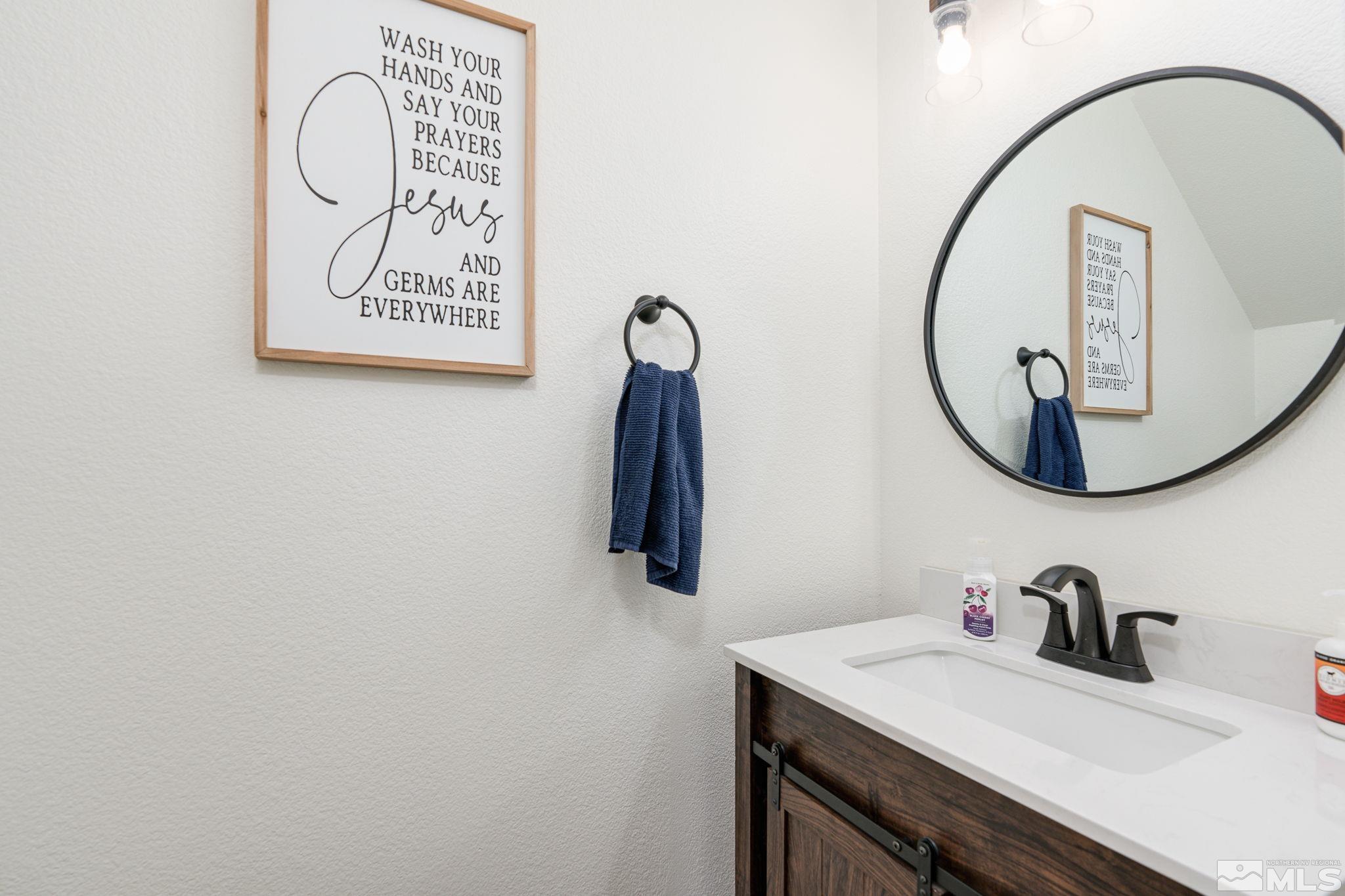 18198 Pin Oak Court Reno, NV 89508 - Photo 15 of 39 a bathroom with a sink and a mirror