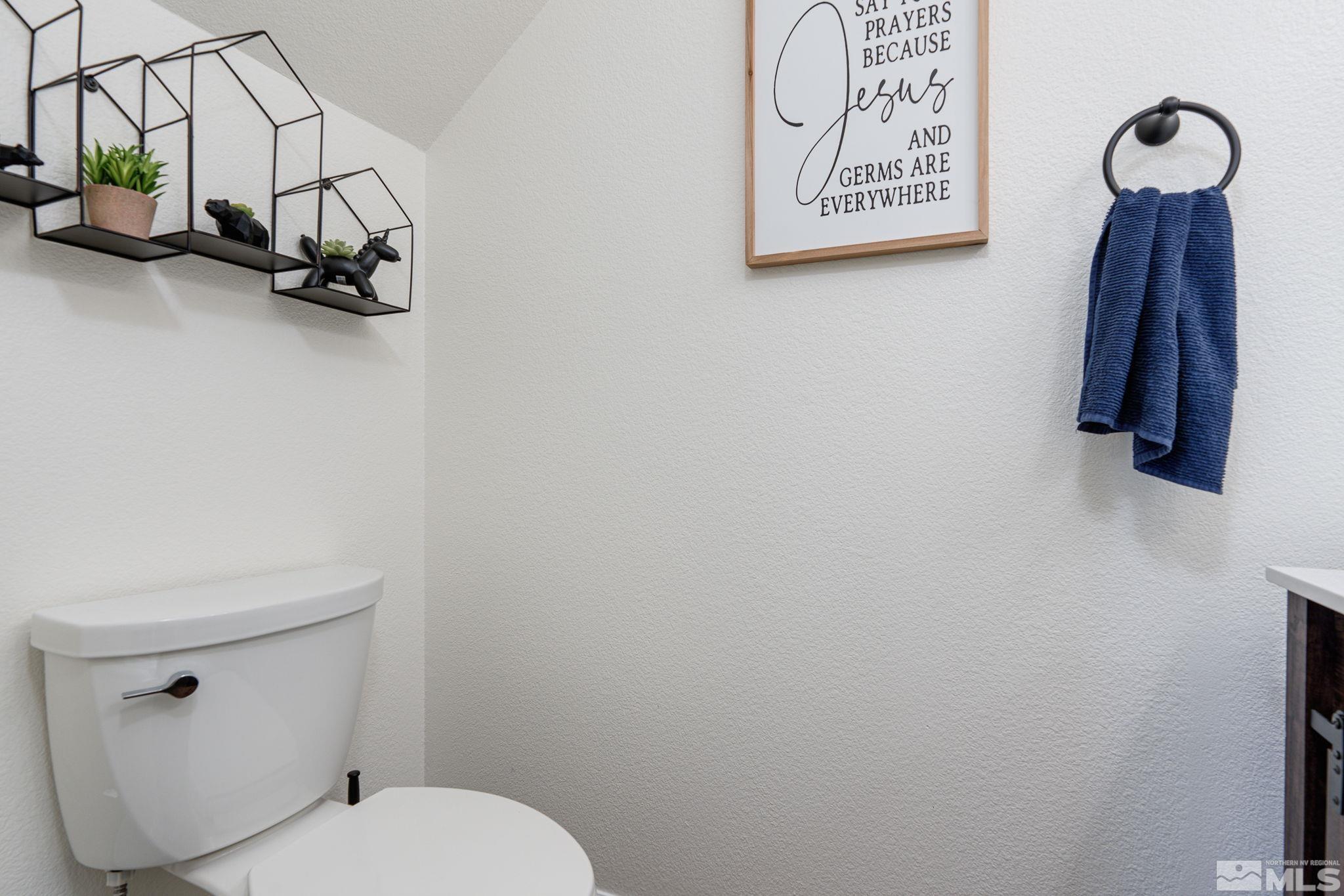 18198 Pin Oak Court Reno, NV 89508 - Photo 16 of 39 a bathroom with a toilet sink and vanity