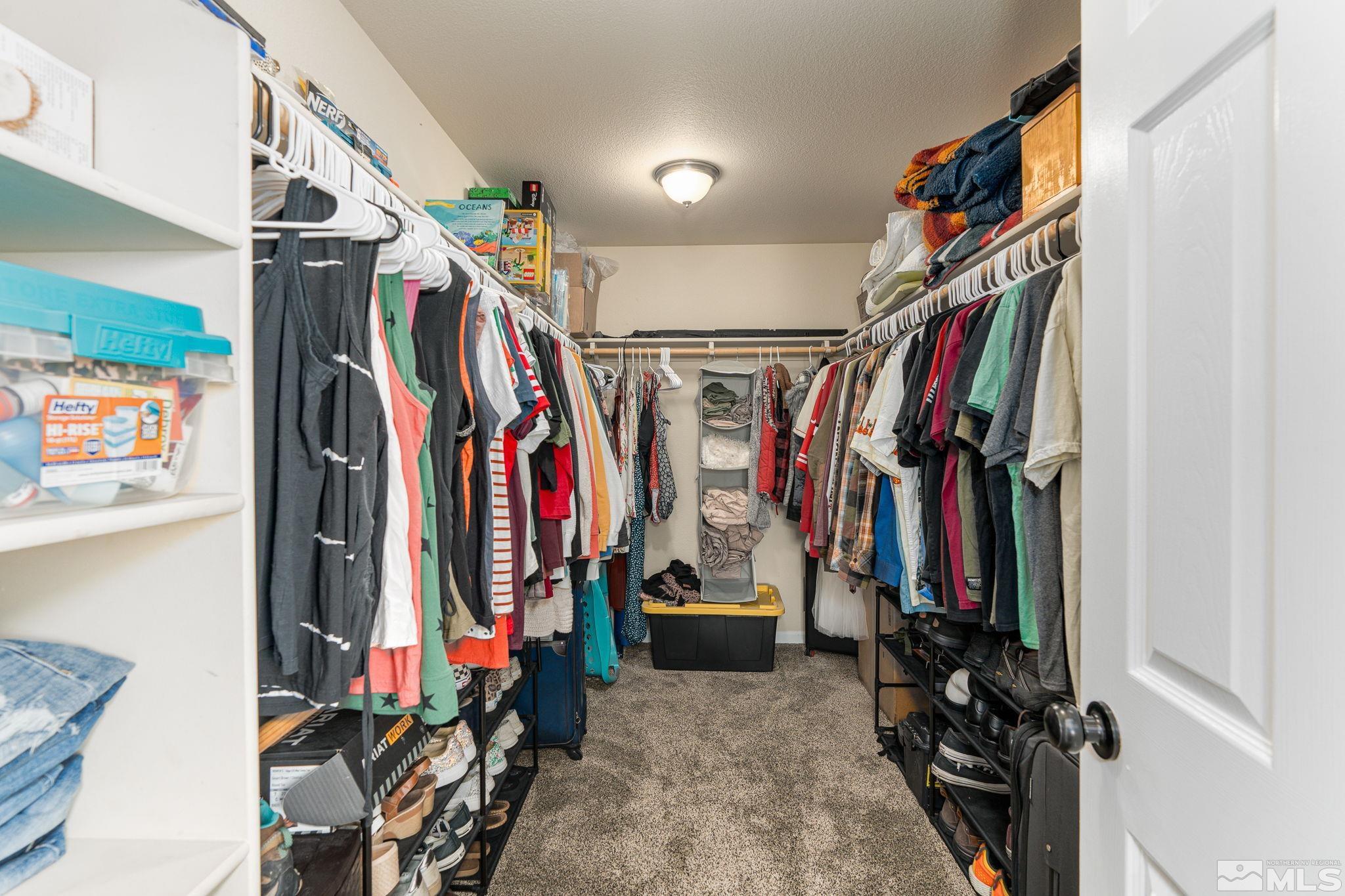 18198 Pin Oak Court Reno, NV 89508 - Photo 21 of 39 a view of walk in closet with clothes
