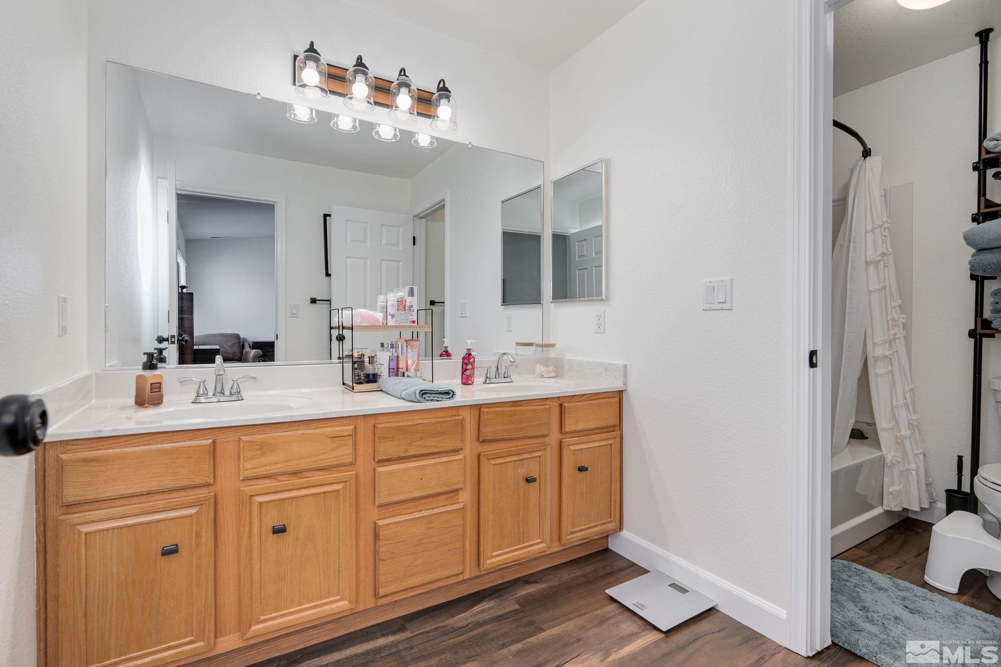 18198 Pin Oak Court Reno, NV 89508 - Photo 22 of 39 a bathroom with a sink double vanity and a mirror