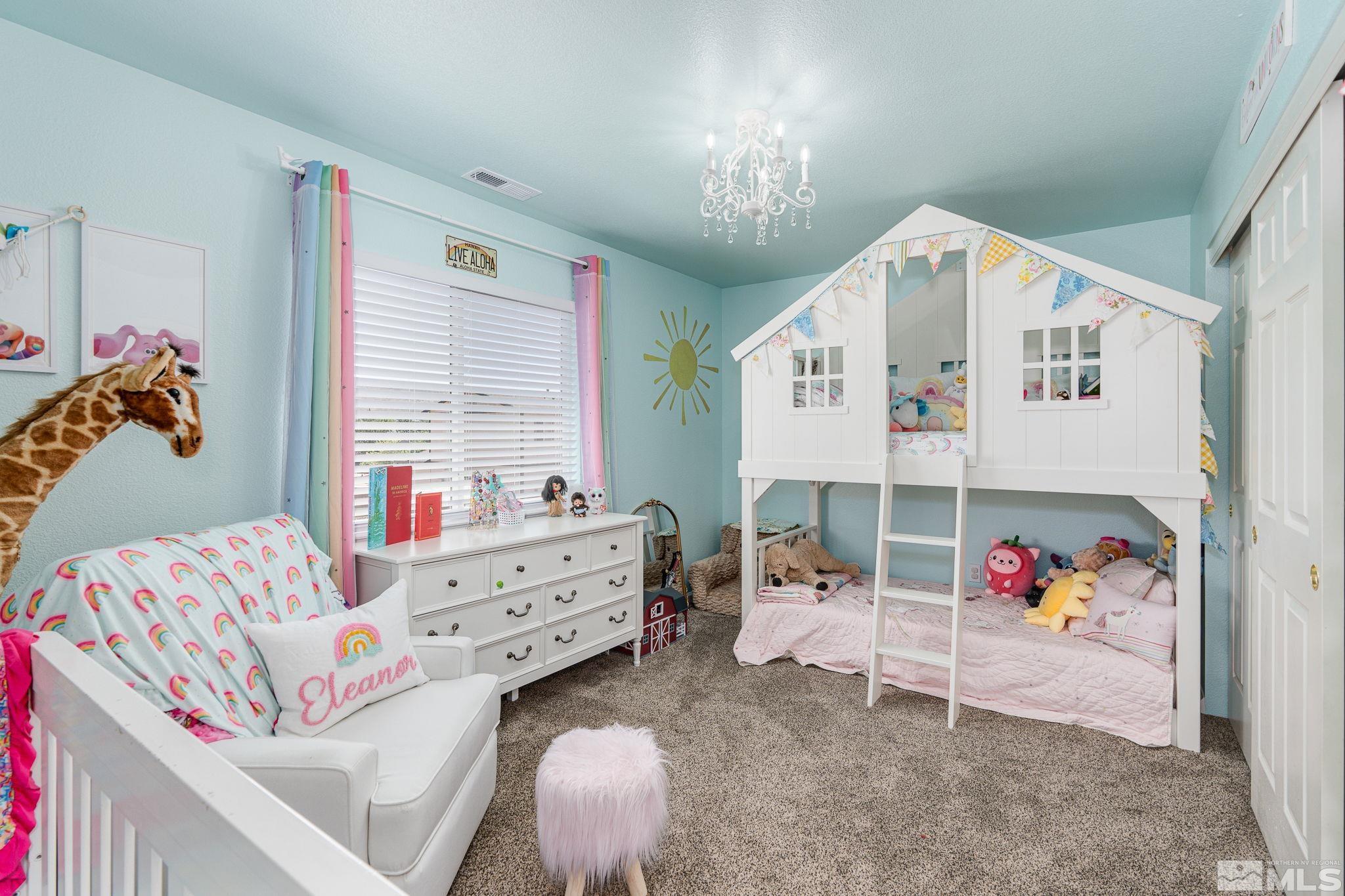 18198 Pin Oak Court Reno, NV 89508 - Photo 25 of 39 a bedroom with furniture and a baby crib