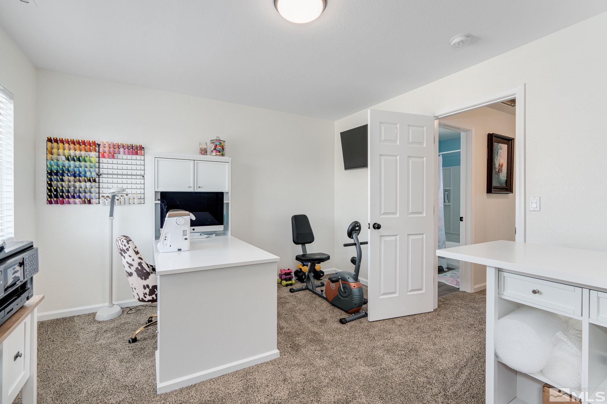 18198 Pin Oak Court Reno, NV 89508 - Photo 27 of 39 a living room with furniture and a flat screen tv