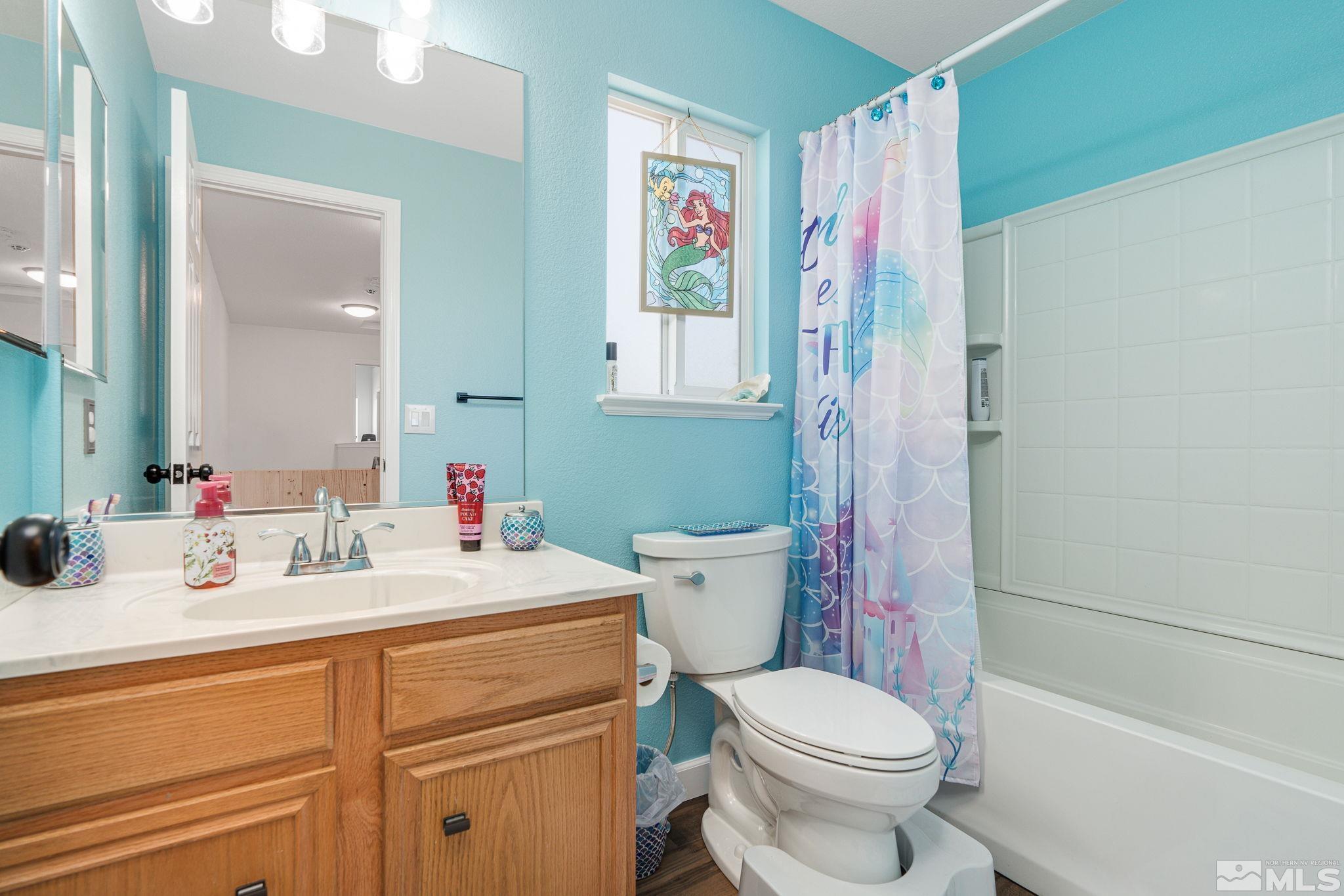 18198 Pin Oak Court Reno, NV 89508 - Photo 28 of 39 a bathroom with a sink toilet and shower