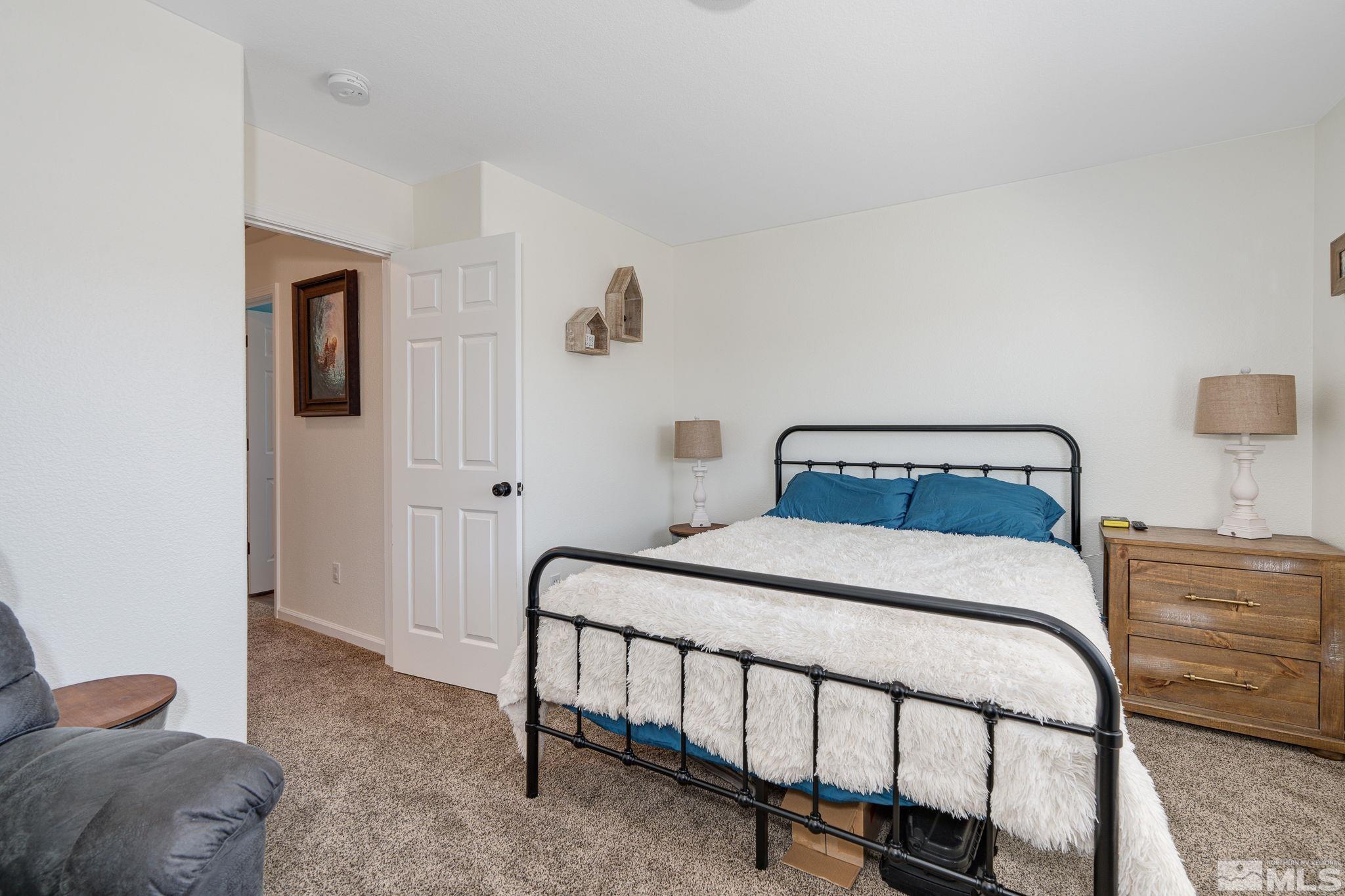 18198 Pin Oak Court Reno, NV 89508 - Photo 30 of 39 a bedroom with a bed and a window