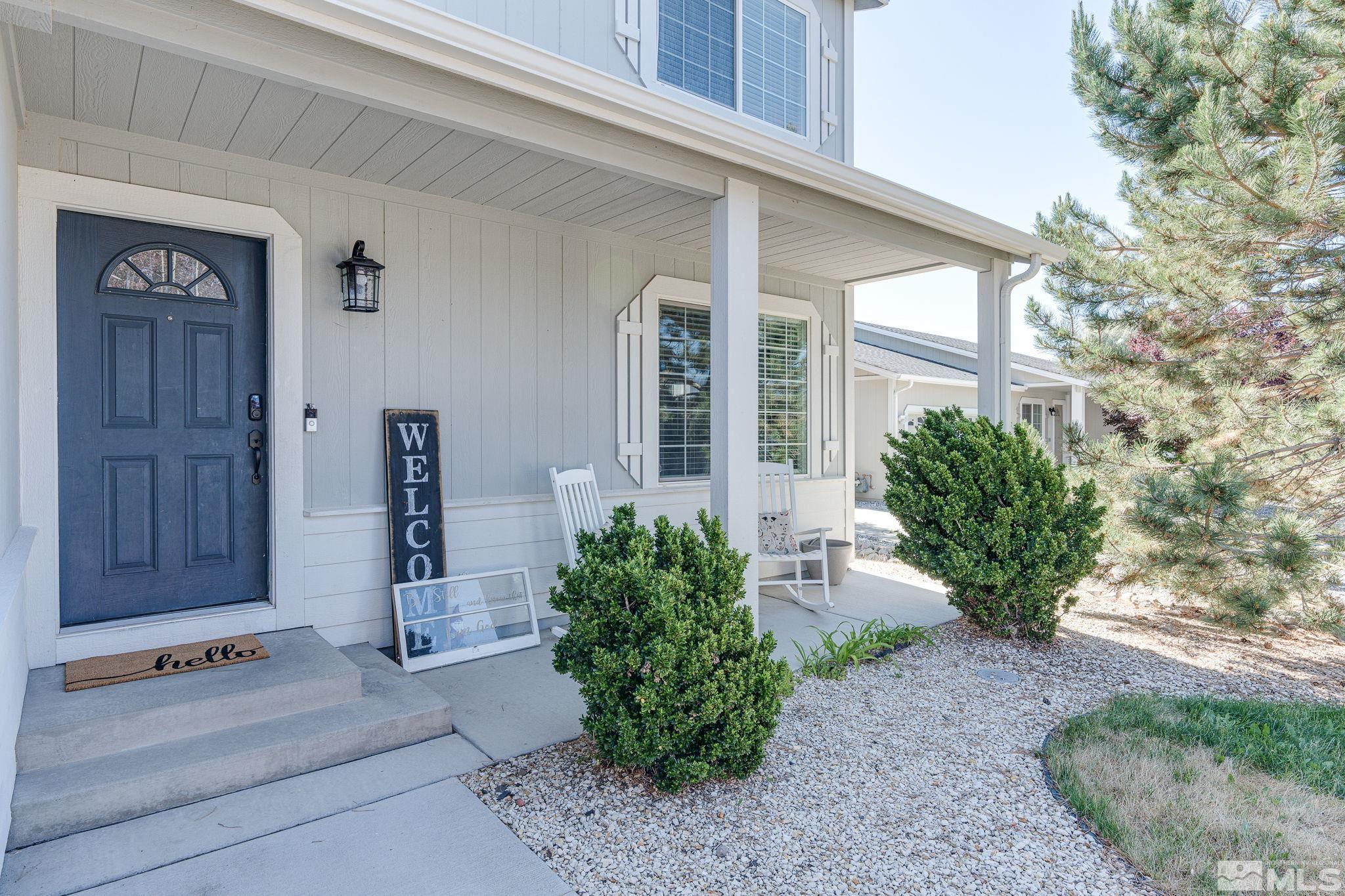 18198 Pin Oak Court Reno, NV 89508 - Photo 3 of 39 a front view of a house with garden