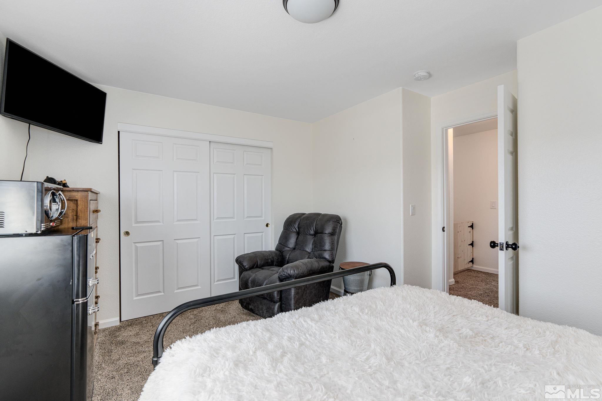 18198 Pin Oak Court Reno, NV 89508 - Photo 31 of 39 a bedroom with bed and tv