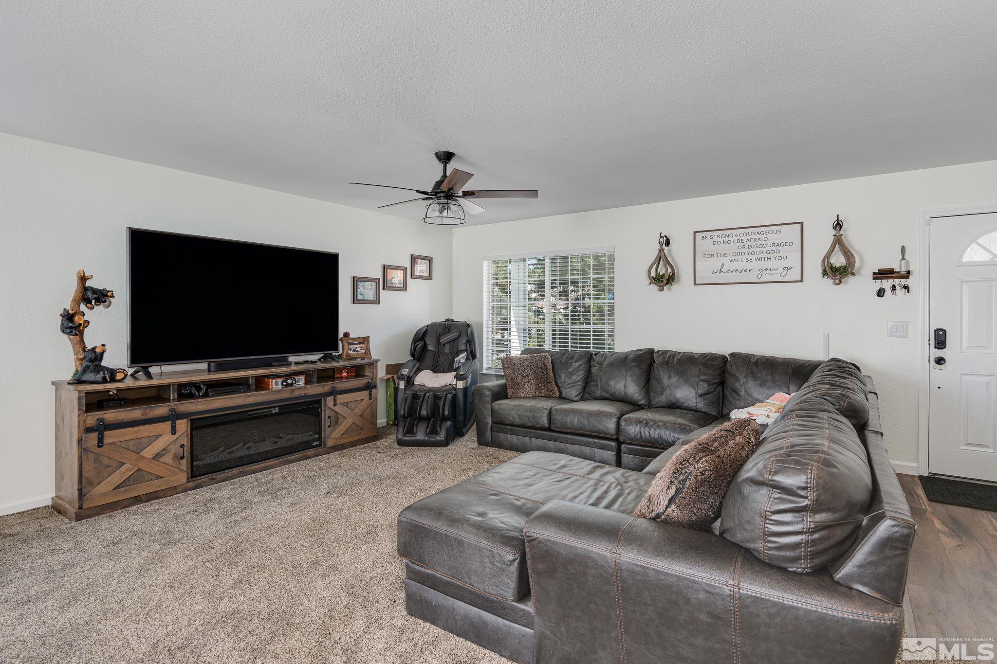 18198 Pin Oak Court Reno, NV 89508 - Photo 4 of 39 a living room with furniture and a flat screen tv