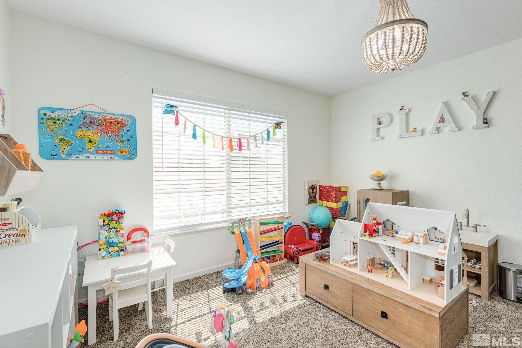 18198 Pin Oak Court Reno, NV 89508 - Photo 6 of 39 a workspace with furniture toys toys and a baby crib