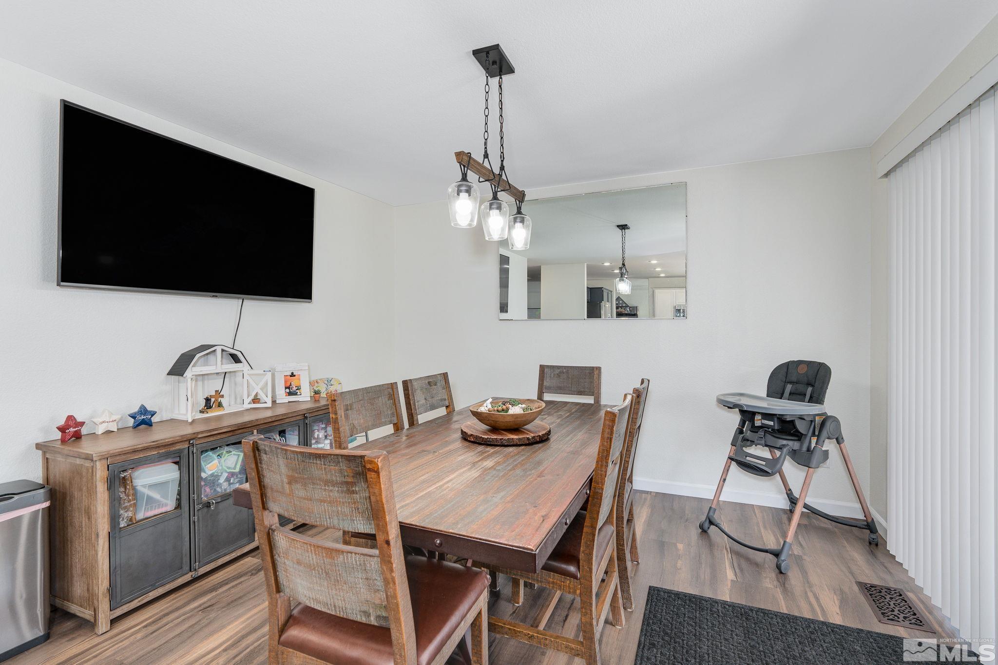 18198 Pin Oak Court Reno, NV 89508 - Photo 10 of 39 a view of a dining room with furniture and wooden floor
