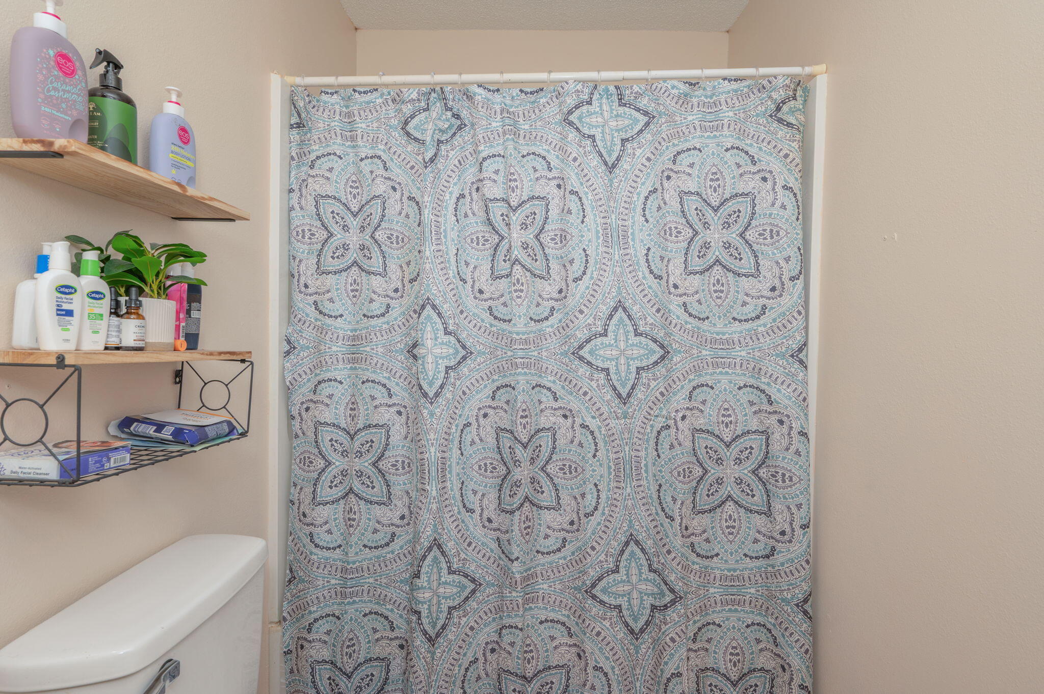 834 McDonald Street Crestview, FL 32536 - Photo 20 of 35 a bathroom with a toilet and a shower curtain