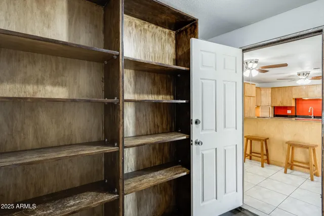 a kitchen with stainless steel appliances kitchen island granite countertop a refrigerator and a stove top oven