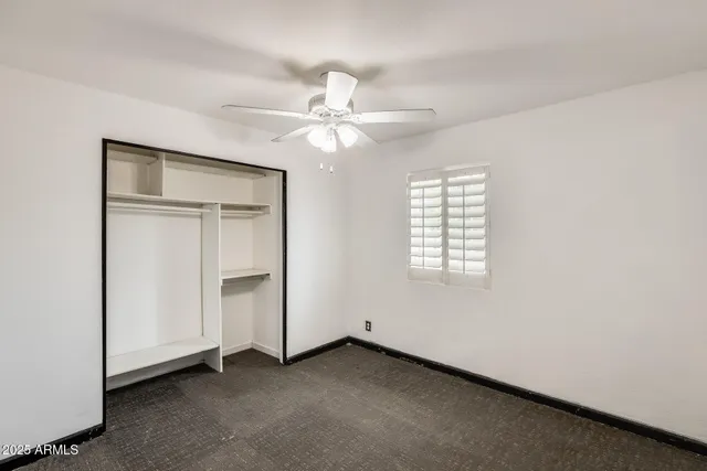a view of a livingroom with wooden floor and a sink
