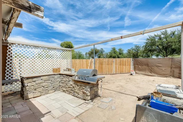 a living room with a couch and a ceiling fan
