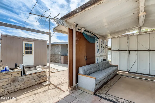 a view of a porch with wooden floor and stairs