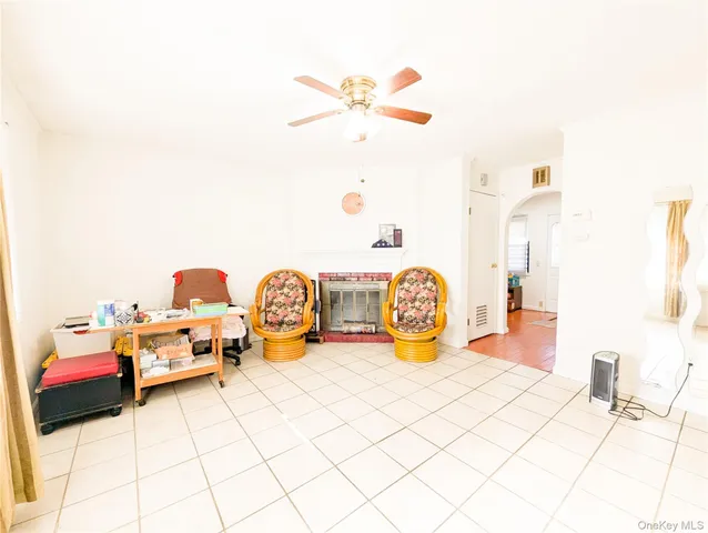 a view of a room with wooden floor and carpet