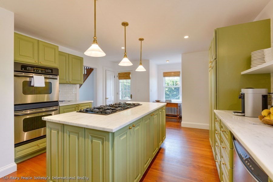 3 North Beach Street Nantucket, MA 02554 - Photo 5 of 13 a kitchen with a stove and a wooden floor