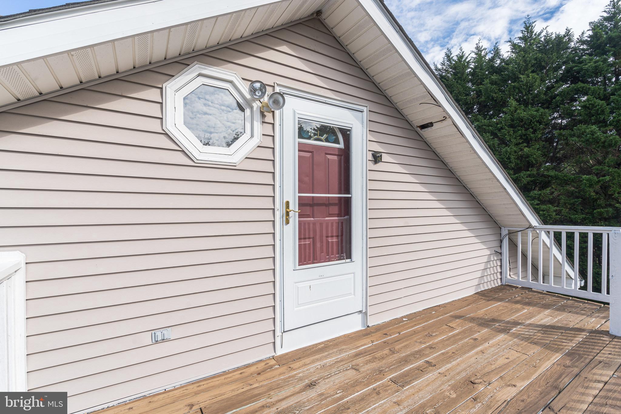 8281 Solomons Island Road Owings, MD 20736 - Photo 22 of 44 Upper level entry with deck