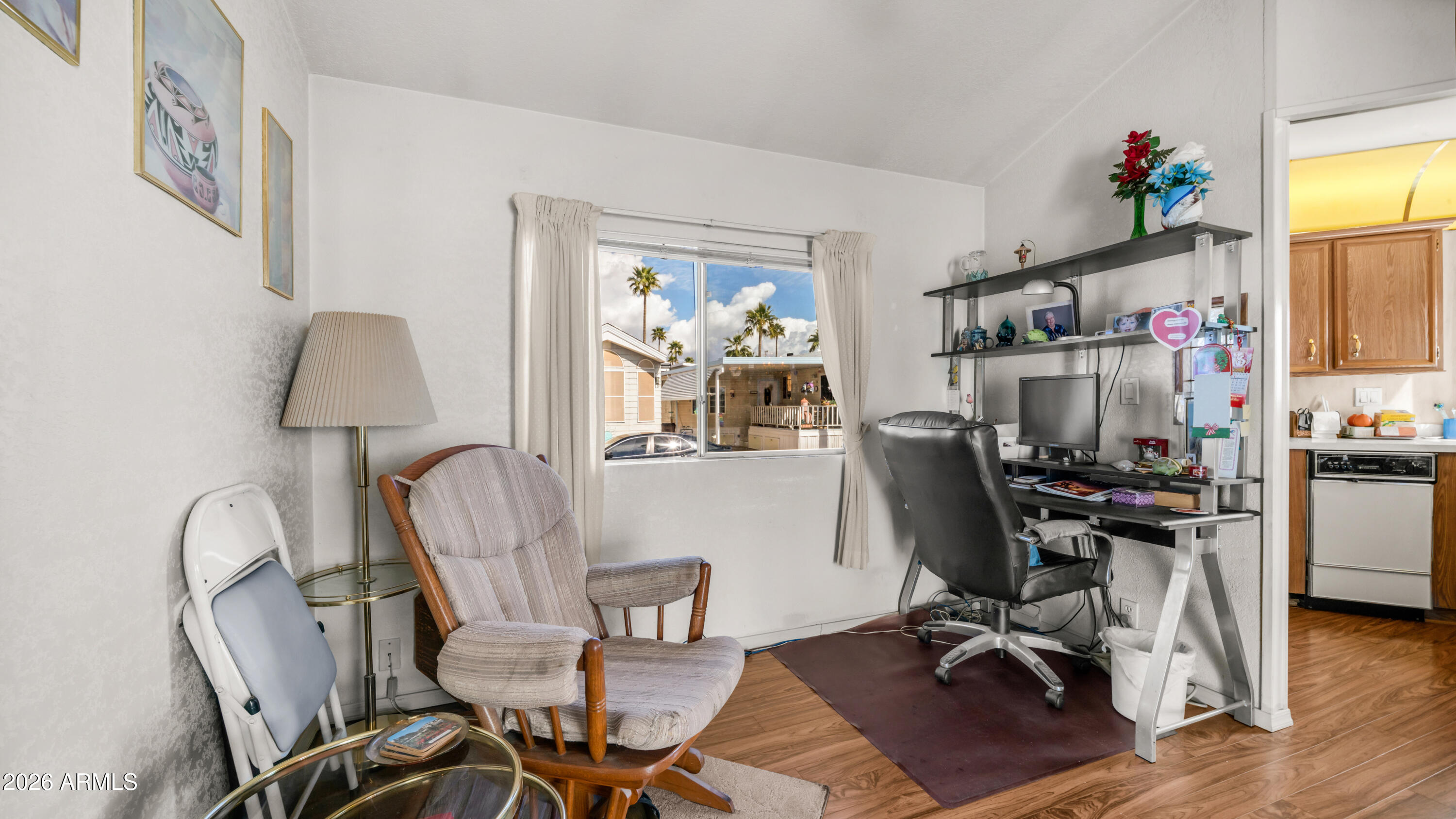 3710 South Goldfield Road, Unit 972 Apache Junction, AZ 85119 - Photo 18 of 60 a view of a workspace with furniture and a window
