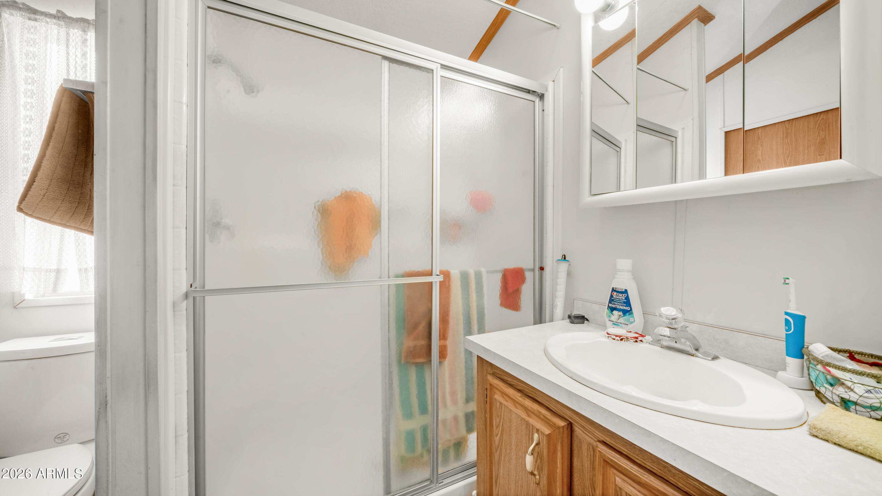 3710 South Goldfield Road, Unit 972 Apache Junction, AZ 85119 - Photo 22 of 60 a bathroom with a sink and mirror