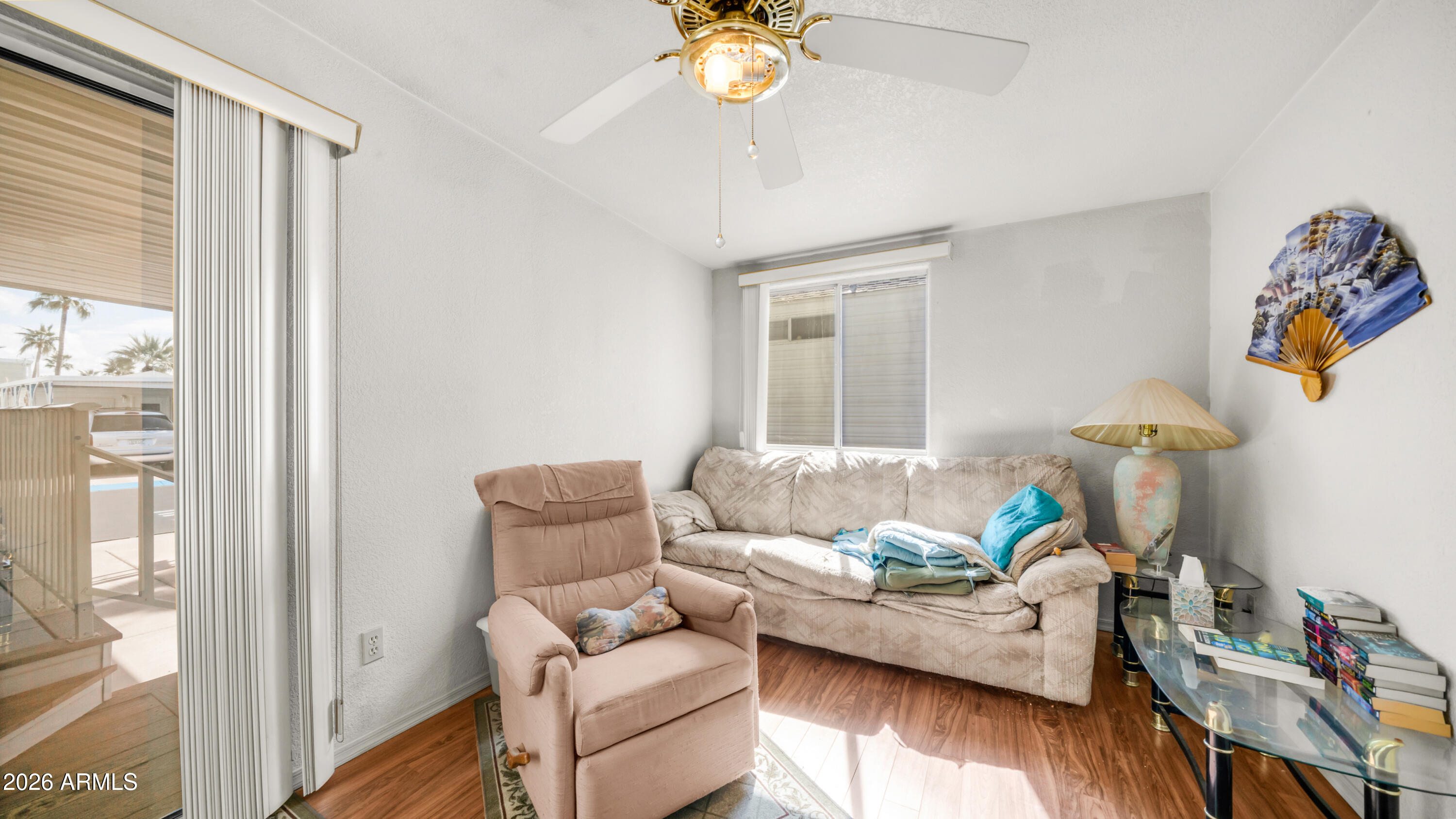 3710 South Goldfield Road, Unit 972 Apache Junction, AZ 85119 - Photo 25 of 60 a living room with furniture and a window