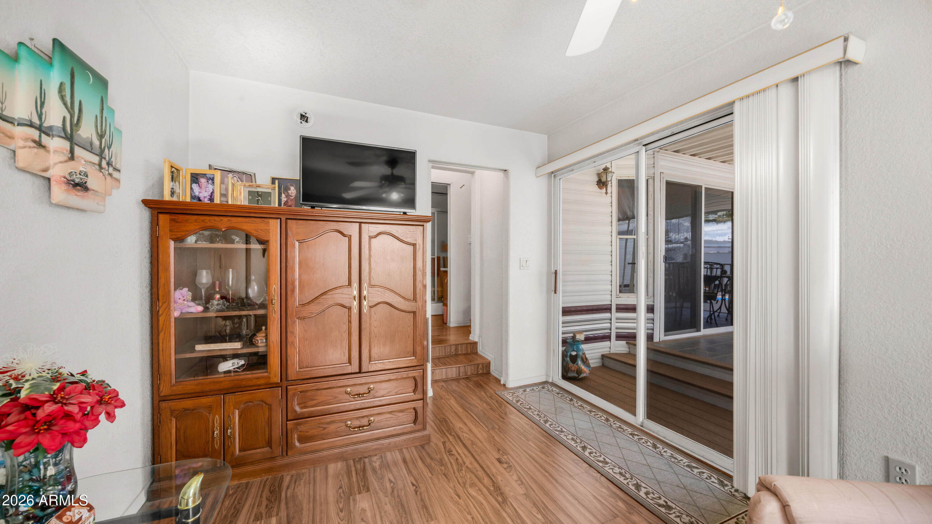 3710 South Goldfield Road, Unit 972 Apache Junction, AZ 85119 - Photo 26 of 60 a kitchen with granite countertop a refrigerator and a stove top oven